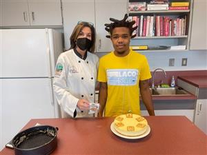 Student Kasheem Cummings and instructor Eileen LoSasso celebrate National Dessert Day.